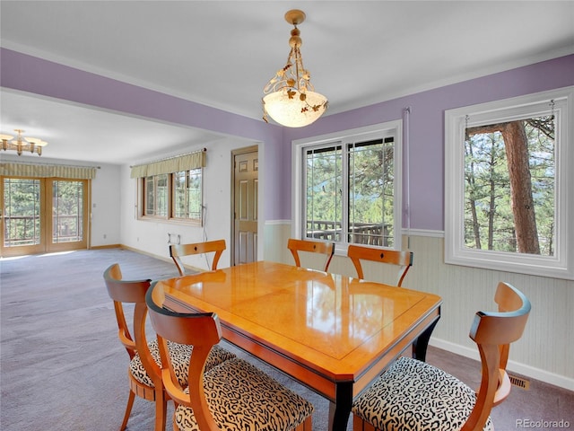 5336 High Rd, Evergreen, CO 80439 - carpeted dining space with a wainscoted wall and wooden walls