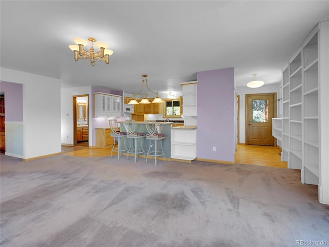 5336 High Rd, Evergreen, CO 80439 - living area with light colored carpet and a chandelier