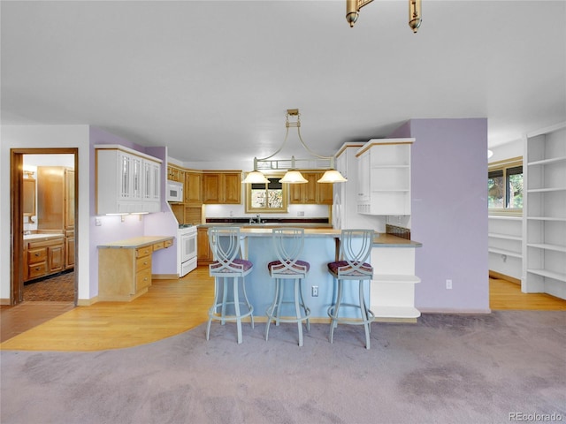 5336 High Rd, Evergreen, CO 80439 - kitchen featuring white appliances, open shelves, a peninsula, and light carpet