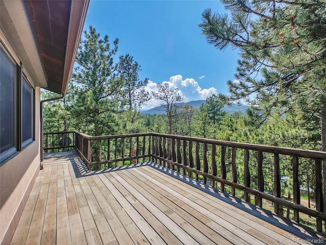 5336 High Rd, Evergreen, CO 80439 - deck with a mountain view and a wooded view