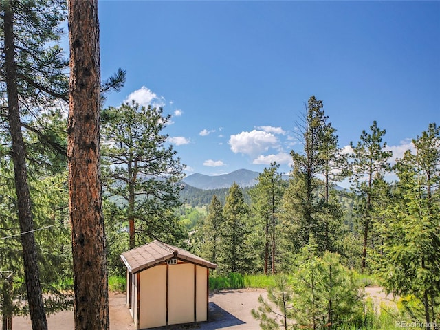 5336 High Rd, Evergreen, CO 80439 - mountain view featuring a forest