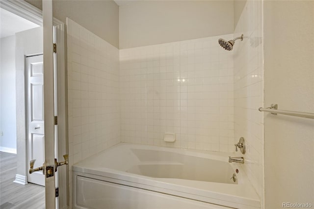 bathroom with wood-type flooring and shower / bath combination