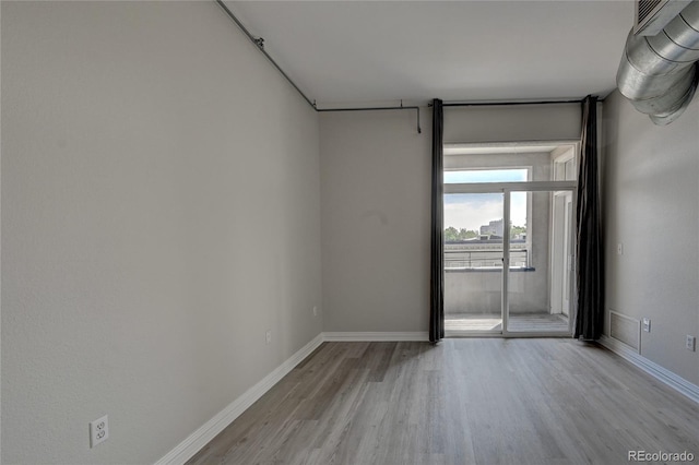 unfurnished room featuring light wood-type flooring