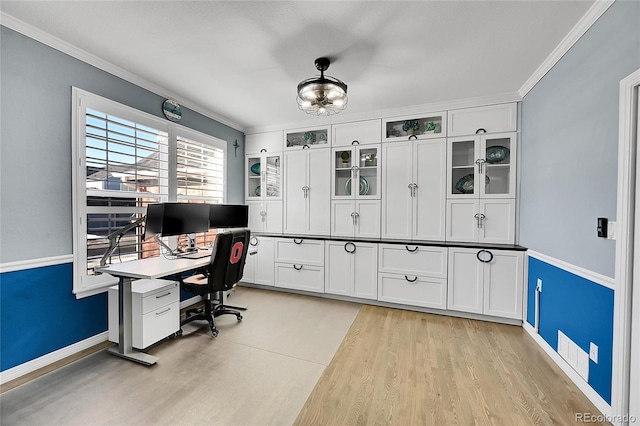 office featuring ornamental molding and light hardwood / wood-style flooring