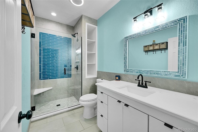 bathroom with vanity, an enclosed shower, tile patterned floors, and toilet