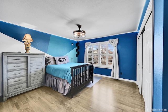 bedroom featuring hardwood / wood-style flooring and a closet