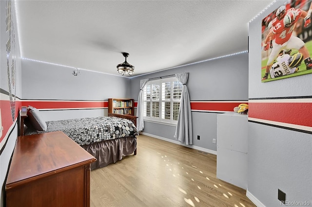 bedroom with hardwood / wood-style flooring