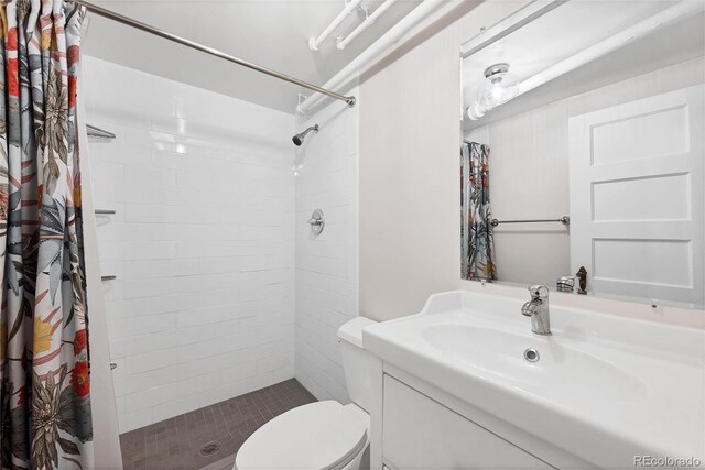 770 Locust, Denver, CO 80220 - bathroom with a shower stall, toilet, and vanity