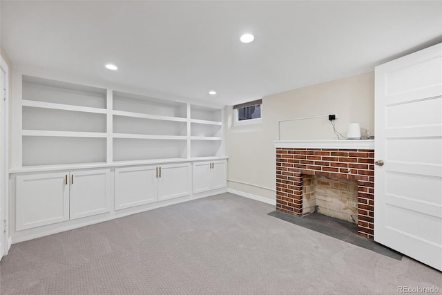 770 Locust, Denver, CO 80220 - unfurnished living room featuring a brick fireplace, carpet, recessed lighting, and built in features