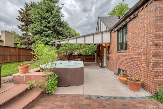770 Locust, Denver, CO 80220 - view of patio / terrace with a hot tub and a fenced backyard