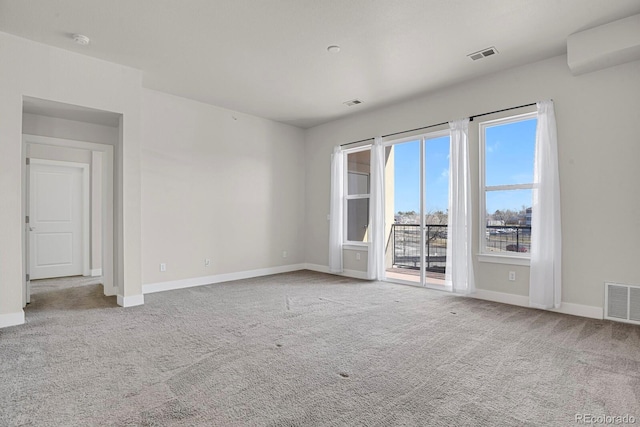 14321 E Tennessee Ave Unit 1-301, Aurora, CO 80012 - carpeted empty room featuring visible vents and baseboards