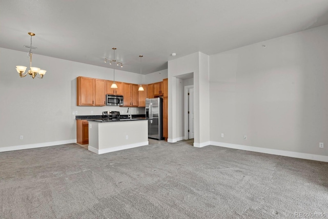 14321 E Tennessee Ave Unit 1-301, Aurora, CO 80012 - kitchen with hanging light fixtures, dark countertops, stainless steel appliances, open floor plan, and a chandelier