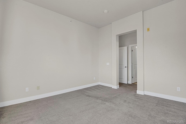 14321 E Tennessee Ave Unit 1-301, Aurora, CO 80012 - carpeted empty room featuring baseboards