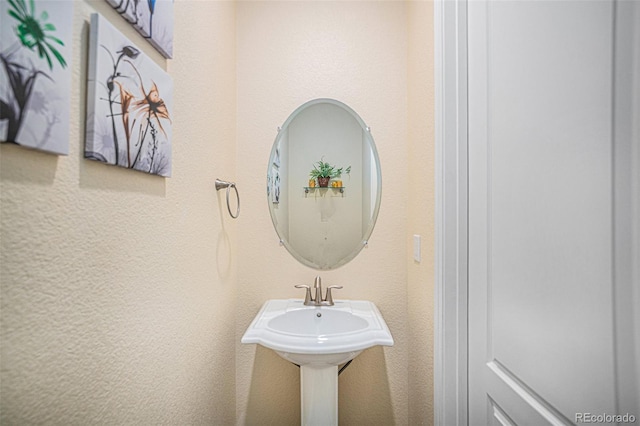 bathroom with a textured wall