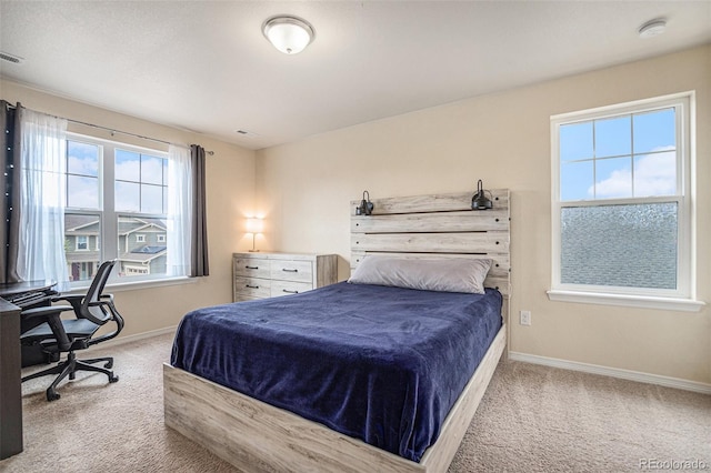 bedroom with visible vents, baseboards, and carpet flooring