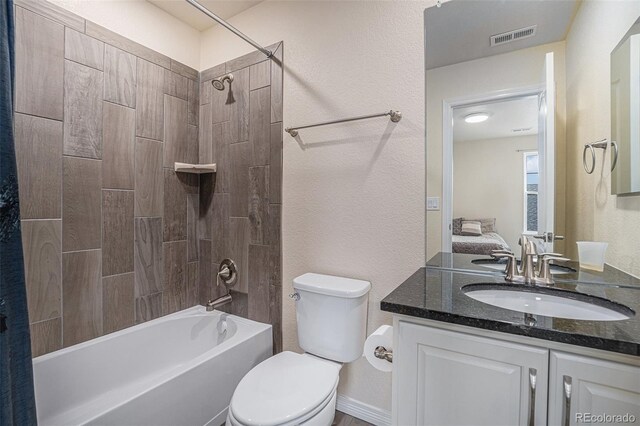 full bath featuring a textured wall, toilet, vanity, visible vents, and tub / shower combination