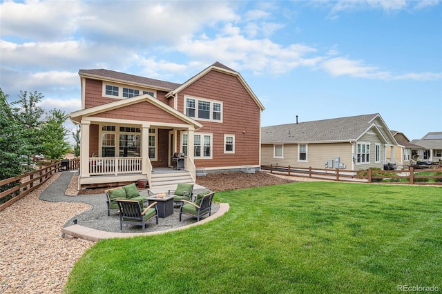 rear view of house featuring an outdoor living space with a fire pit, a fenced backyard, and a yard