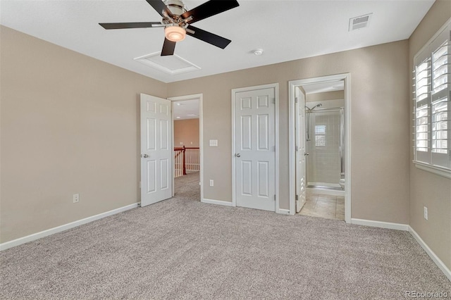 unfurnished bedroom featuring baseboards, visible vents, and light colored carpet