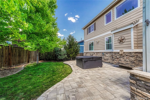10761 Hillsboro Cir, Parker, CO 80134 - fenced backyard featuring a hot tub and a patio