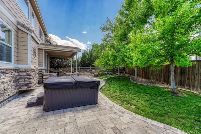 10761 Hillsboro Cir, Parker, CO 80134 - fenced backyard with a hot tub, a patio area, and a grill