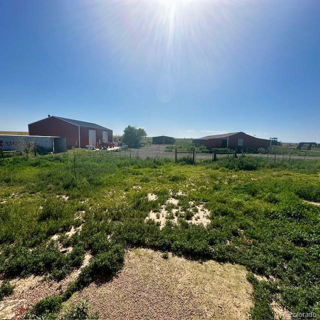 13291 N Harback Rd, Bennett, CO 80102 - view of yard featuring a view of rural / pastoral area
