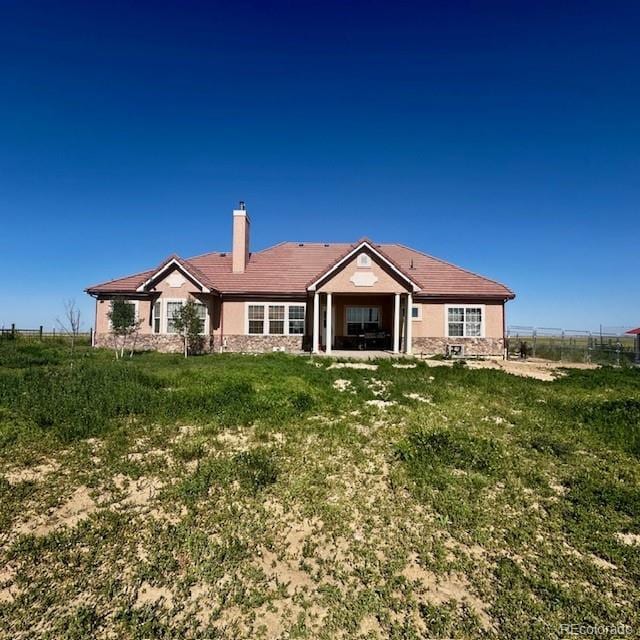 13291 N Harback Rd, Bennett, CO 80102 - rear view of house with a chimney