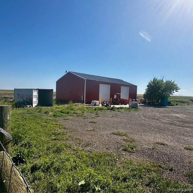 13291 N Harback Rd, Bennett, CO 80102 - view of pole building featuring driveway