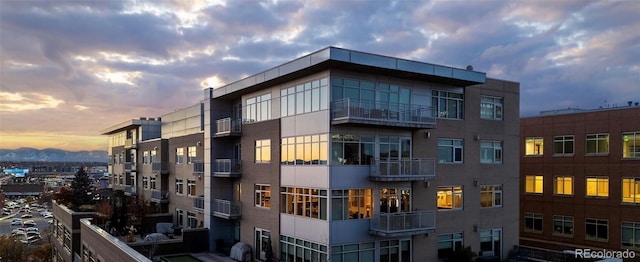 view of outdoor building at dusk