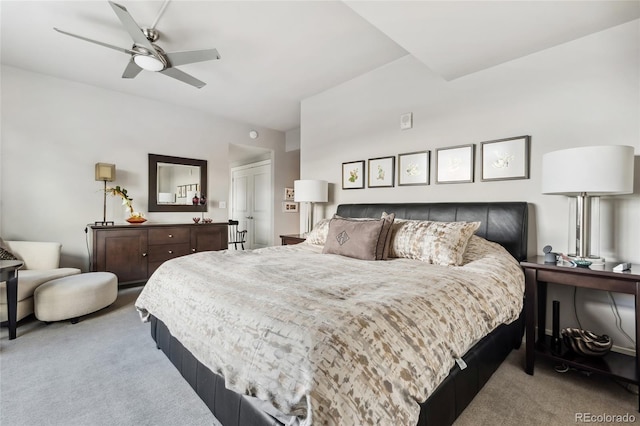 bedroom with light carpet and a ceiling fan