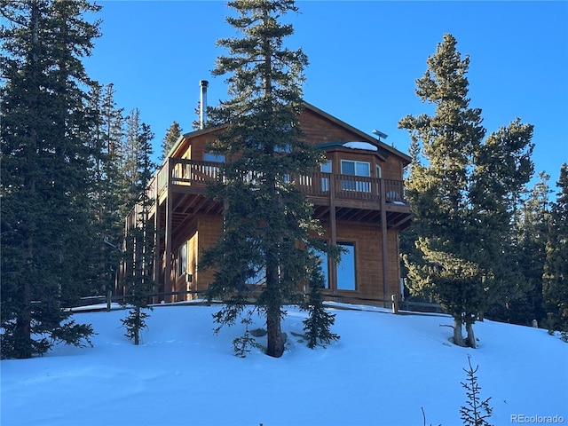 view of front of home featuring a balcony