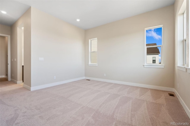 1585 Winter Glow Dr, Windsor, CO 80550 - empty room with visible vents, baseboards, recessed lighting, and light colored carpet