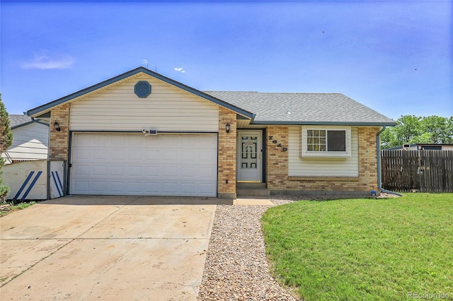 7610 S Garland St, Littleton, CO 80128 - single story home with brick siding, driveway, an attached garage, and a shingled roof