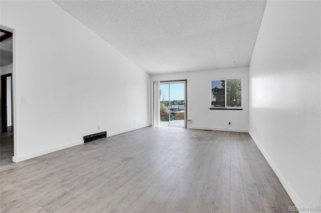 7610 S Garland St, Littleton, CO 80128 - unfurnished room featuring a textured ceiling and wood finished floors
