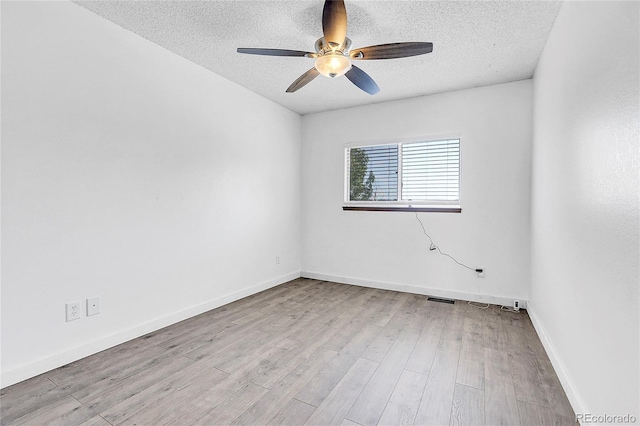 7610 S Garland St, Littleton, CO 80128 - unfurnished room featuring a textured ceiling, ceiling fan, and wood finished floors