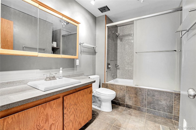 7610 S Garland St, Littleton, CO 80128 - full bath with tiled shower / bath, vanity, and tile patterned flooring