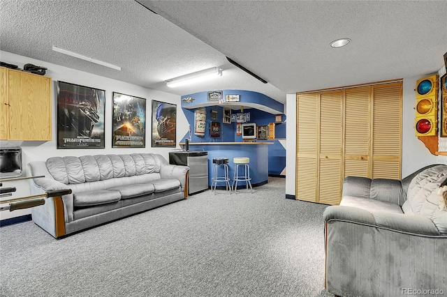 7610 S Garland St, Littleton, CO 80128 - carpeted living area featuring a textured ceiling and baseboards