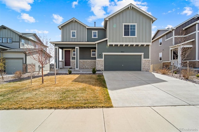 craftsman inspired home featuring an attached garage, stone siding, board and batten siding, a front lawn, and driveway
