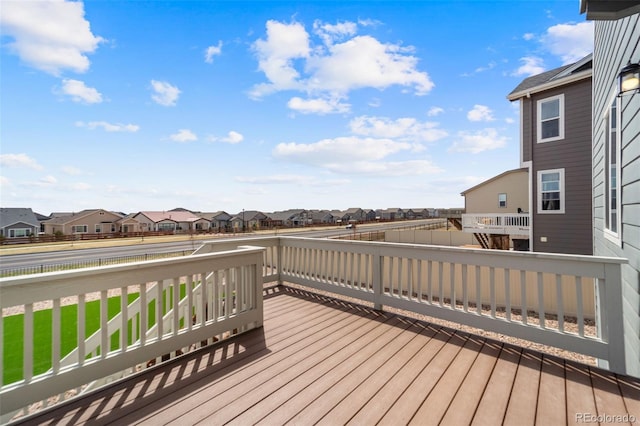 wooden terrace featuring a residential view