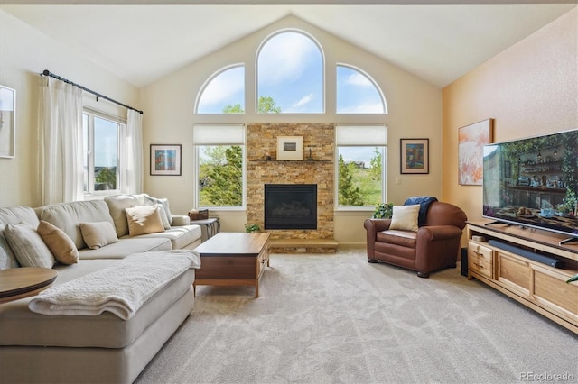 7289 Stroh Rd, Parker, CO 80134 - living area with healthy amount of natural light, light colored carpet, lofted ceiling, and a fireplace