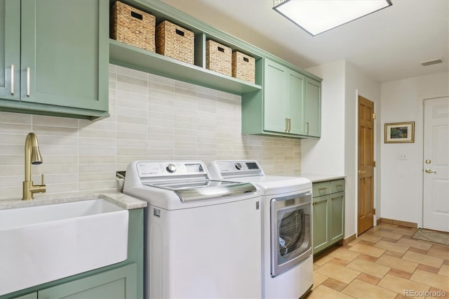 7289 Stroh Rd, Parker, CO 80134 - laundry room with cabinet space and separate washer and dryer
