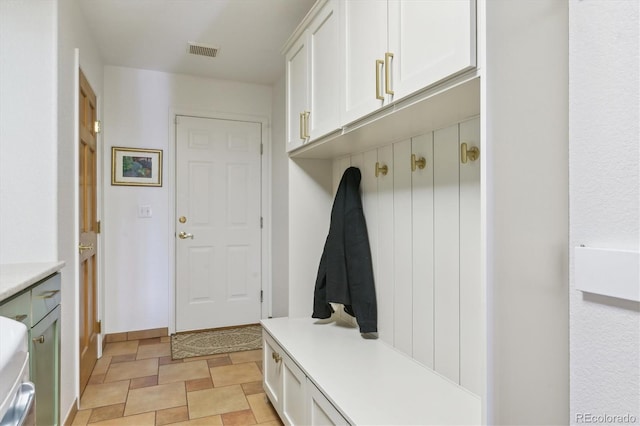 7289 Stroh Rd, Parker, CO 80134 - mudroom featuring baseboards and stone finish flooring
