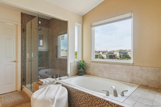 7289 Stroh Rd, Parker, CO 80134 - full bath featuring a garden tub, a shower stall, and vaulted ceiling