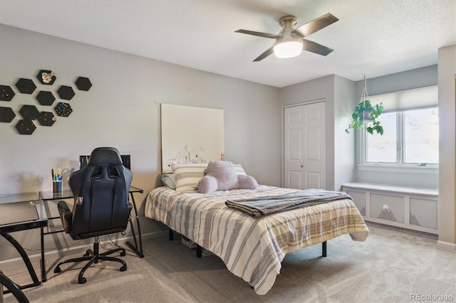 7289 Stroh Rd, Parker, CO 80134 - carpeted bedroom featuring a desk, a ceiling fan, a closet, and baseboards