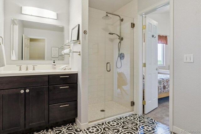 7289 Stroh Rd, Parker, CO 80134 - ensuite bathroom with a shower stall, vanity, and baseboards