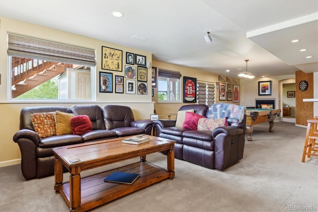 7289 Stroh Rd, Parker, CO 80134 - living area with light carpet, recessed lighting, a glass covered fireplace, and baseboards