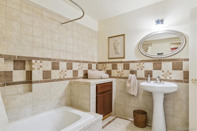 7289 Stroh Rd, Parker, CO 80134 - full bathroom with a bathtub, tile walls, tile patterned flooring, and a sink