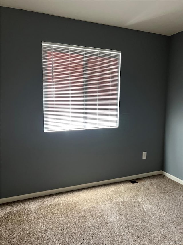 empty room with carpet flooring