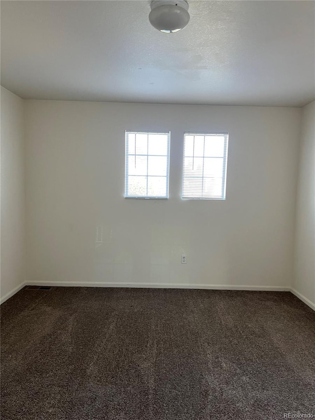 empty room featuring carpet floors