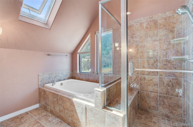 1055 Oak Ridge Rd, Manitou Springs, CO 80829 - full bathroom featuring a bath, a skylight, vaulted ceiling, a stall shower, and tile patterned flooring