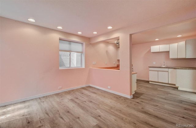 1055 Oak Ridge Rd, Manitou Springs, CO 80829 - unfurnished living room with light wood-type flooring, baseboards, recessed lighting, and a ceiling fan